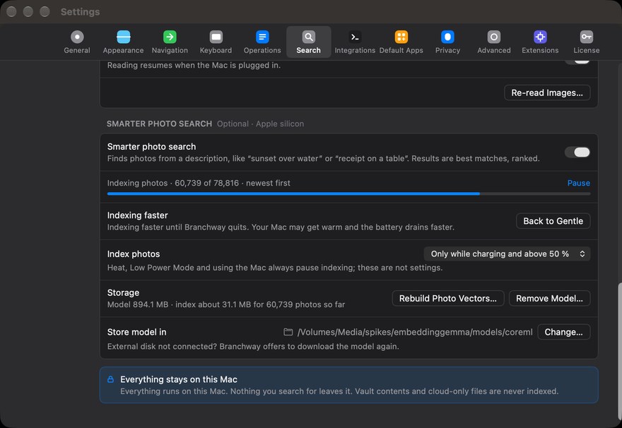 Settings, Search: the Smarter photo search card with its indexing progress, the Index photos choice, where the model is stored, and the note that everything stays on this Mac