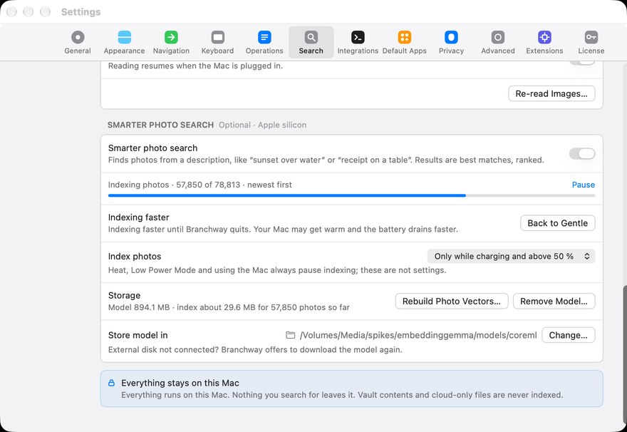 Settings, Search: the Smarter photo search card with its indexing progress, the Index photos choice, where the model is stored, and the note that everything stays on this Mac